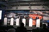 Panel med flere talere på en scene foran en skjerm med teksten «Driving the maritime transition».